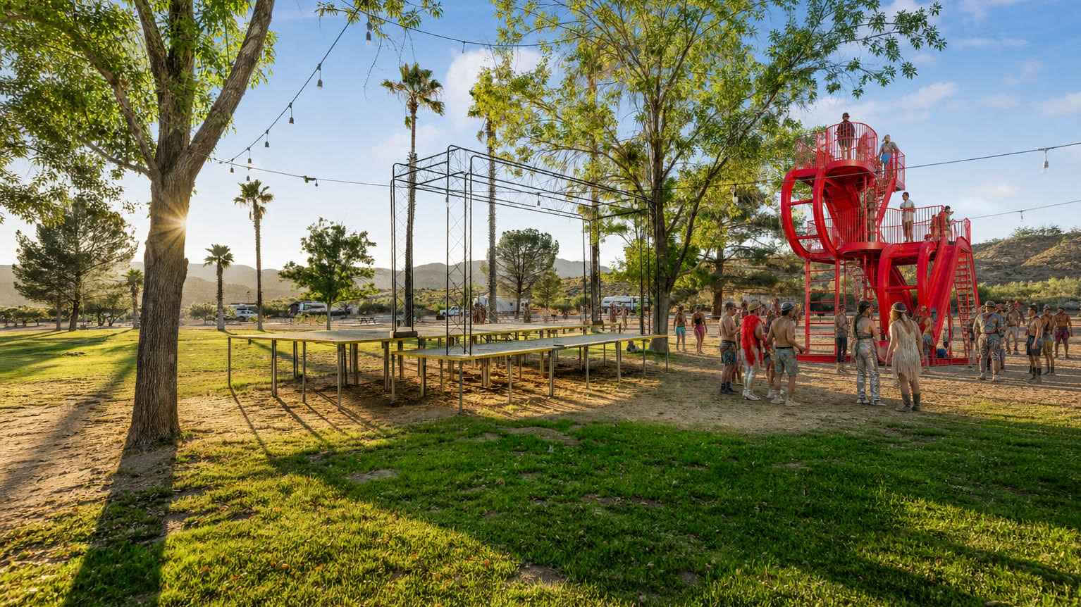 Illustrative daylight placement of a monumental red looping slide beside the existing Colony stage